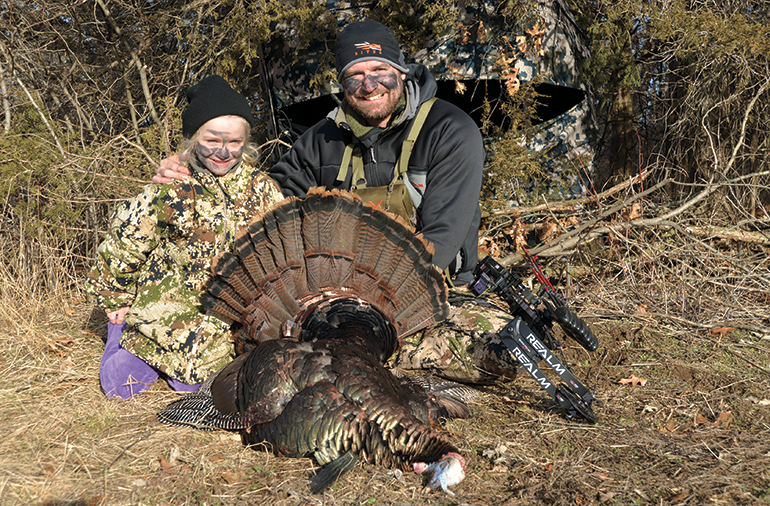 Tony Peterson and daughter with Minnesota archery gobbler