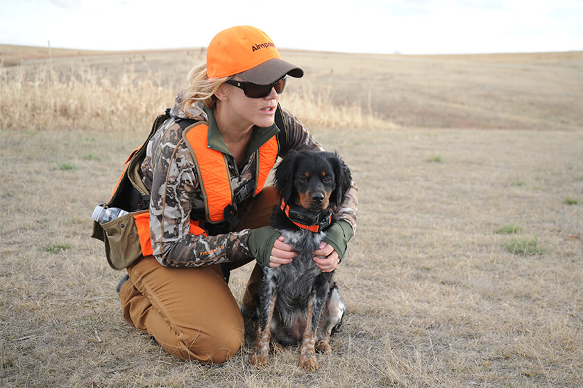 Handler with hunting dog and SportDOG e-collar