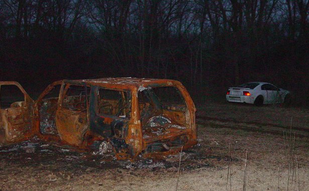 Within 100 yards of where the dumped ducks and geese were found, two stolen vehicles sit. One was burned down to bare metal. (Carlos Gomez photo)