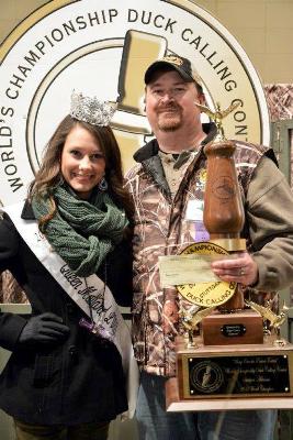 Allen holds his third trophy as he poses with Queen Mallard Hannah Oliver. (Courtesy Stuttgart Chamber of the Commerce)