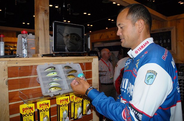 Strike King pro James Niggemeyer looks at the new KVD 8.0 squarebill crankbait that was introduced this week at ICAST 2014 in Orlando. (Photo credit Lynn Burkhead)