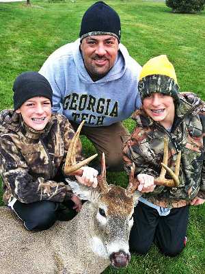 Mark Zona and his twin sons enjoy hunting together.
