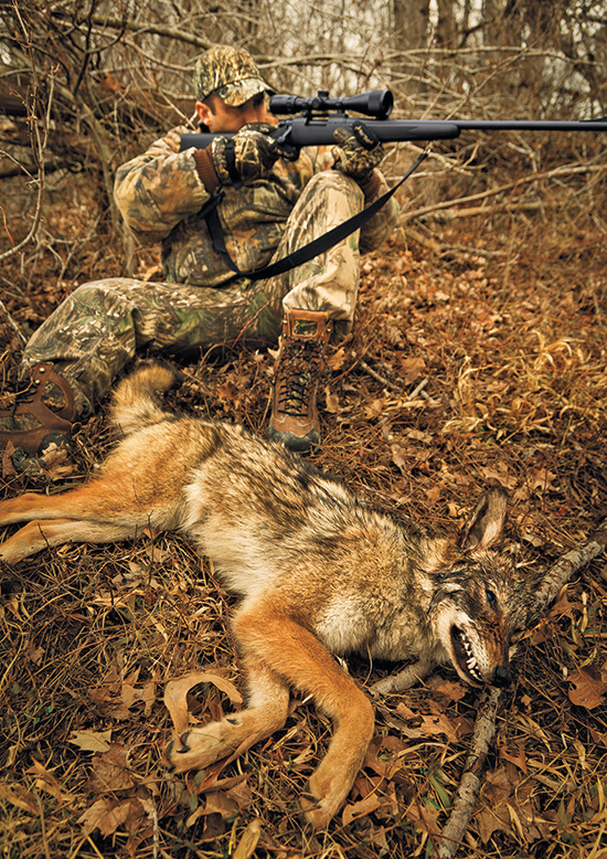 hunter with coyote