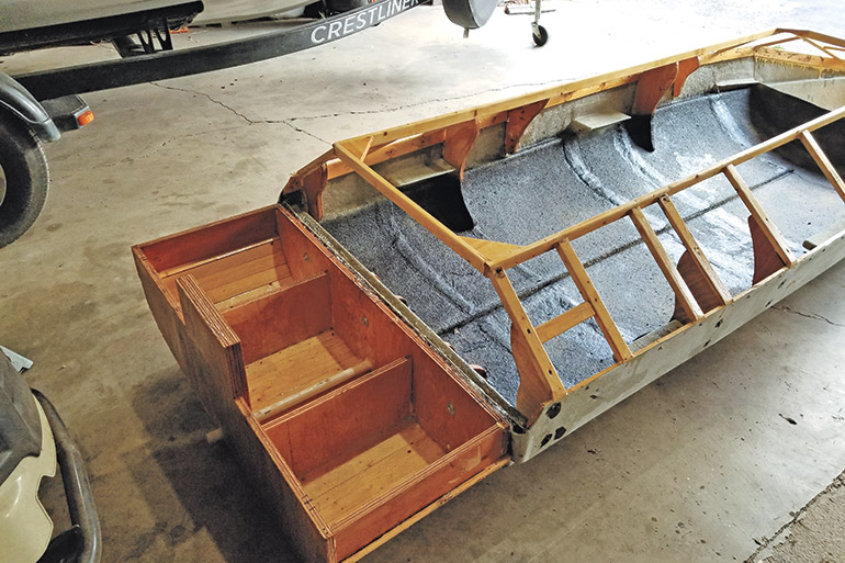 row boat being converted into duck blind