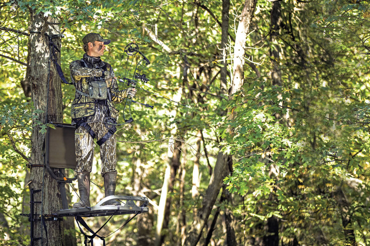 bow hunter in tree stand