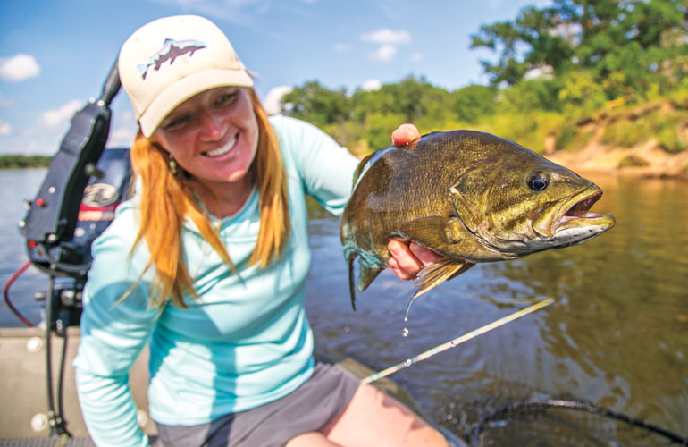 //content.osgnetworks.tv/flyfisherman/content/photos/Heidi-with-WI-River-Pig.jpg