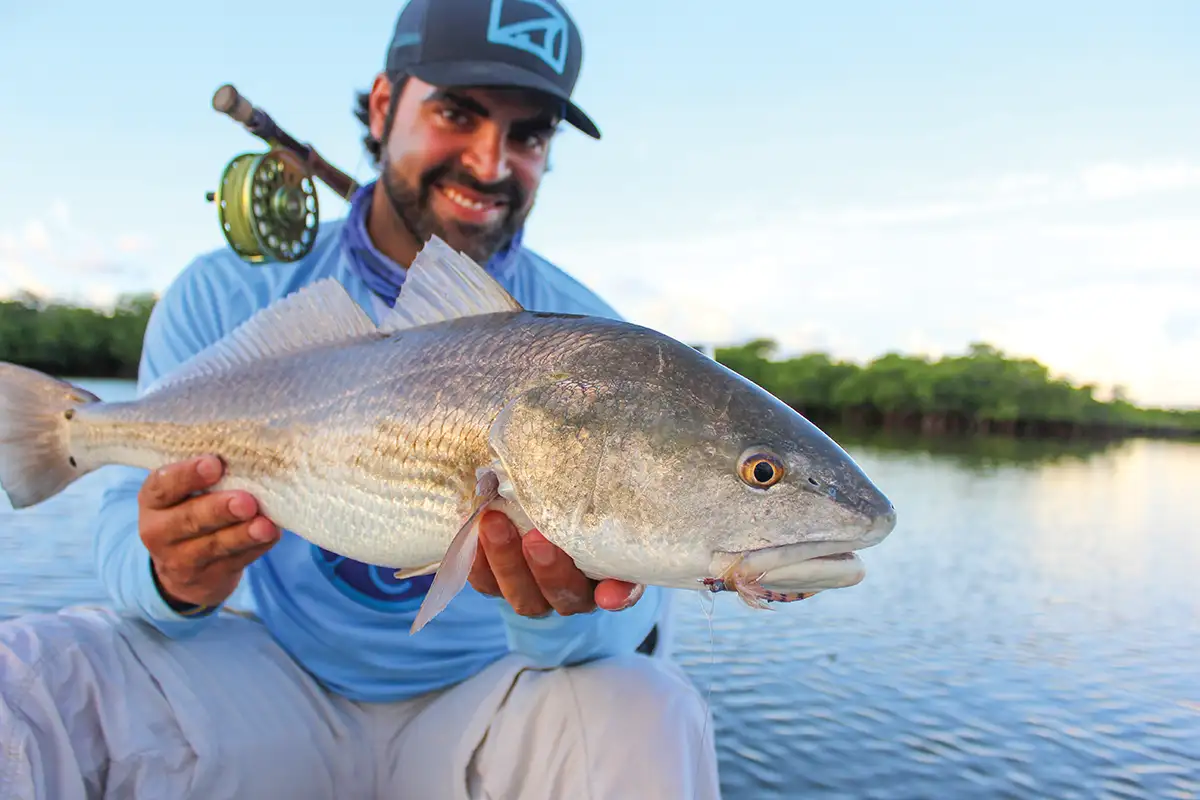 Fly fishing in saltwater flats with CoolNet UV+ Buff for UV