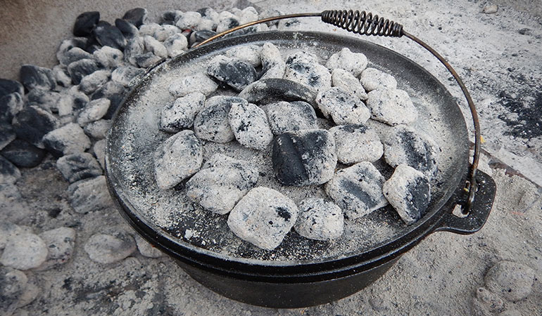 ductch oven cooking coals on top width=