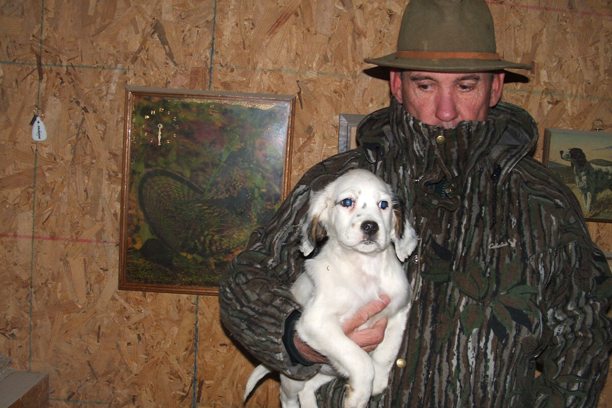roger hoover holding english setter puppyl