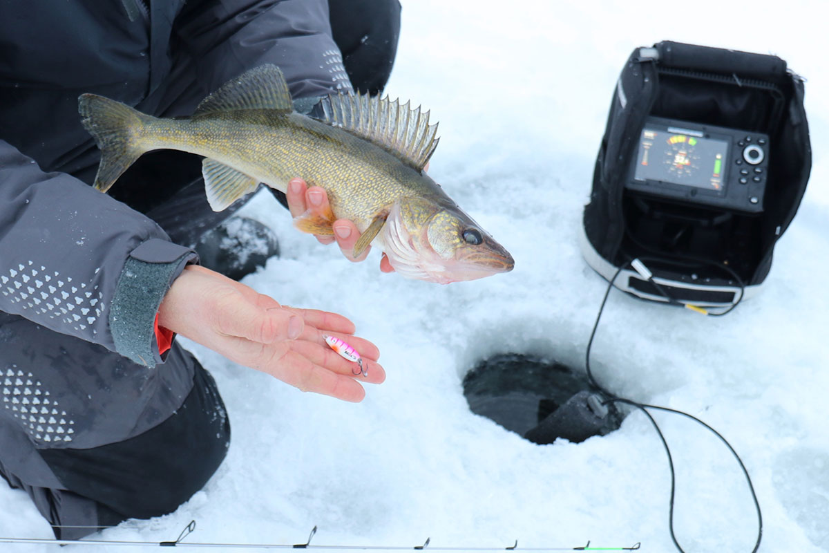 Staying warm while ice fishing on a bucket