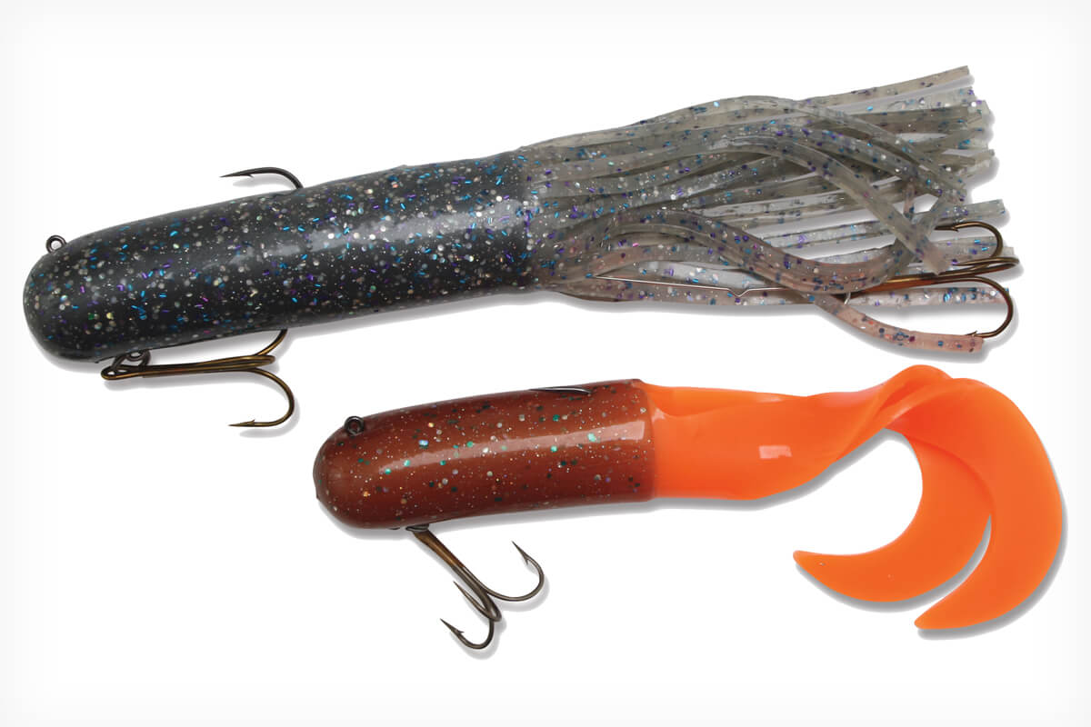 studio photos of Red October Baits tube lures; one speckled gray, one speckled orange