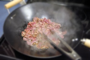 Marinated venison strips in wok/