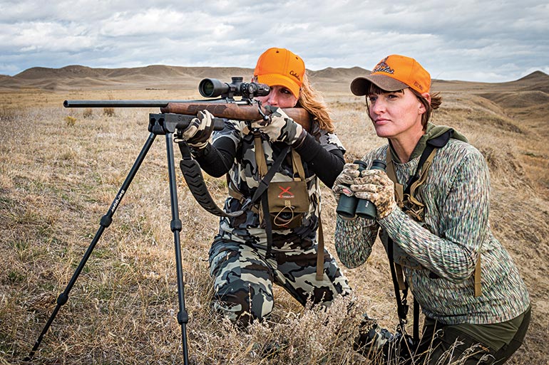 Kali Parmley with rifle and Tess Rousey glassing