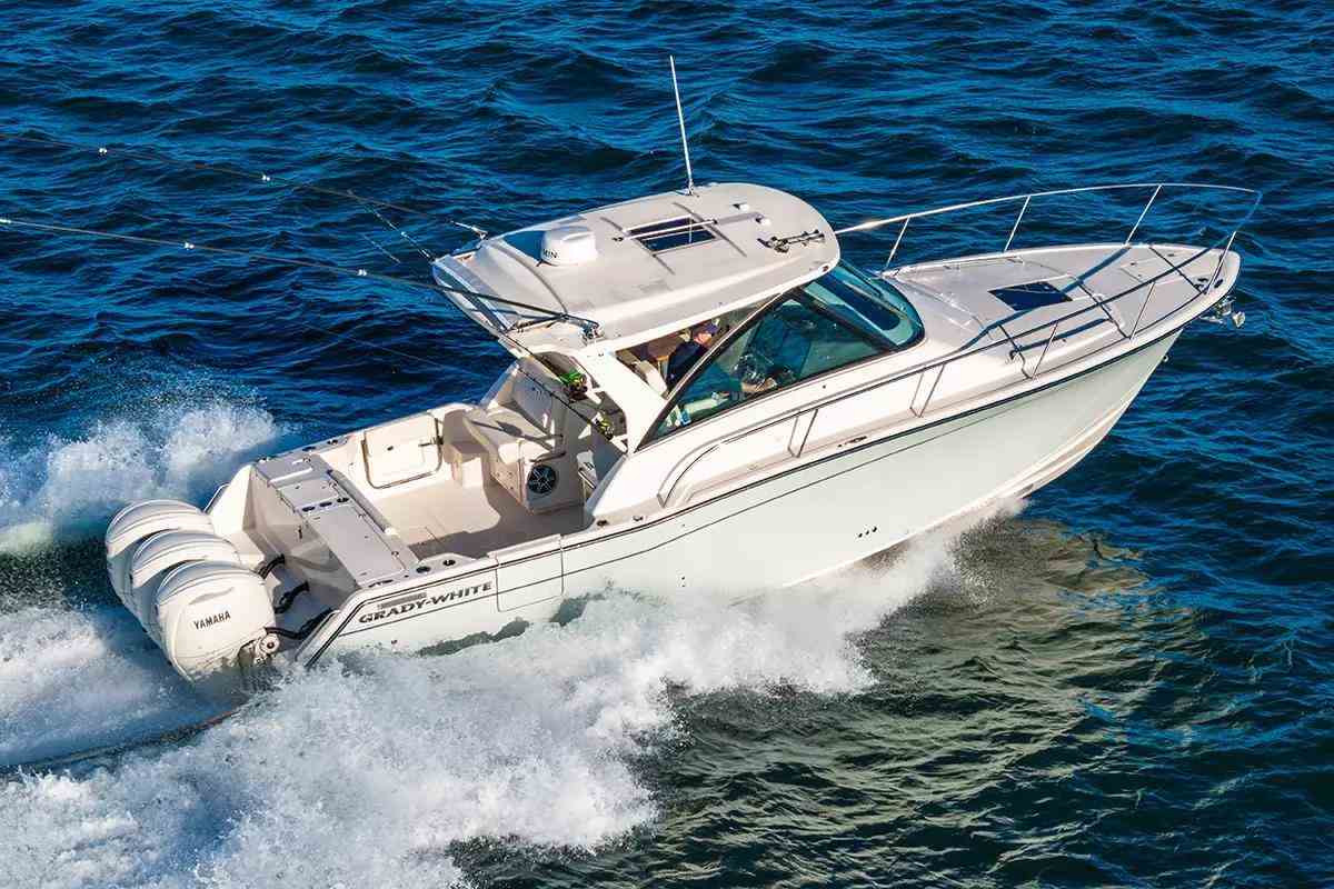 White Grady-White fishing boat running on ocean