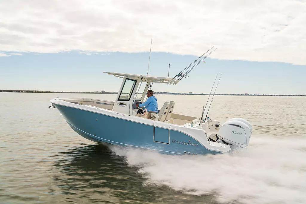 Blue twin engine Sailfish model center console running on bay water