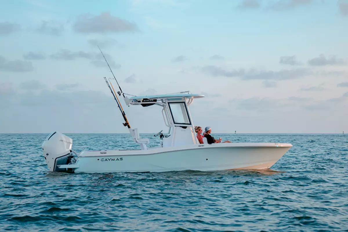 Light blue step hull center console with two anglers seated in bow