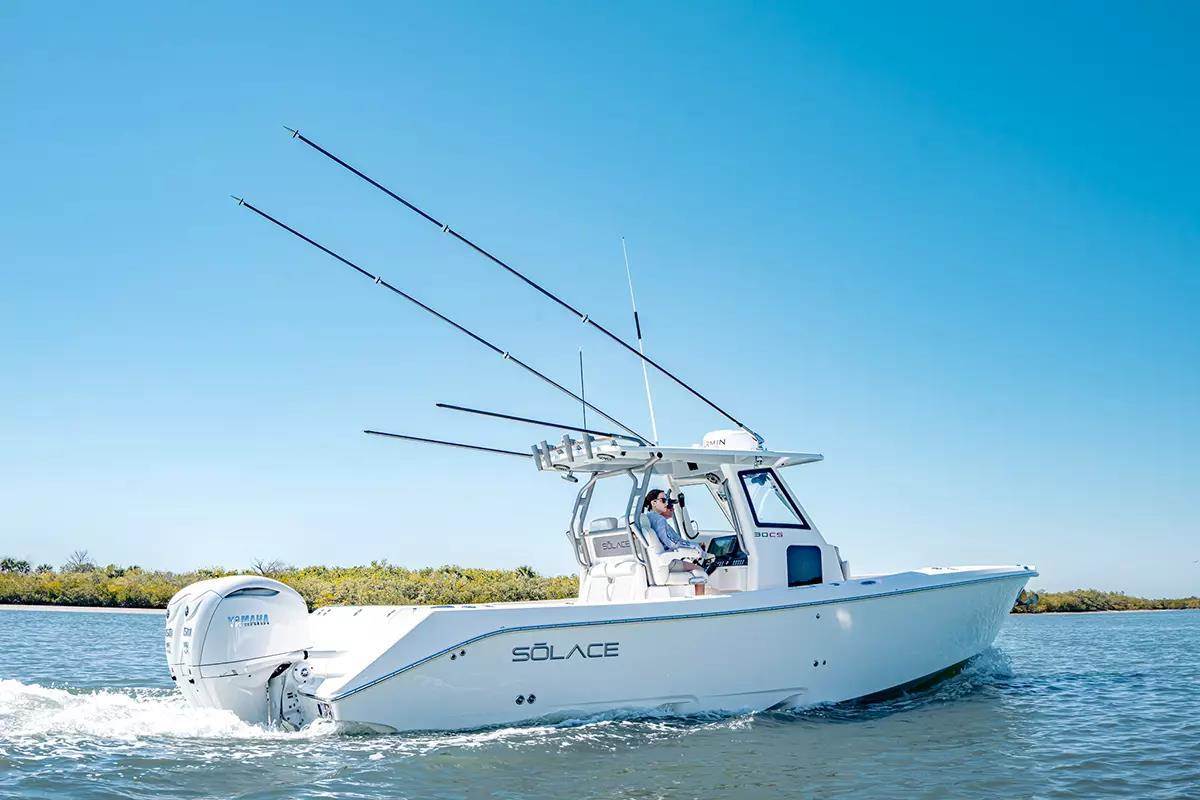 Twin engine white step hull center console boat