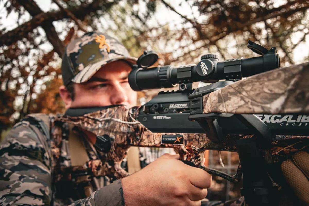 crossbow hunter taking aim