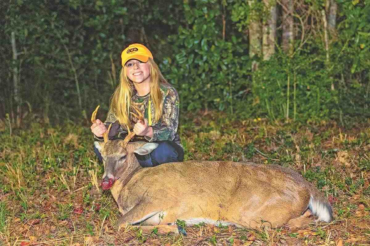 hunter poses with buck