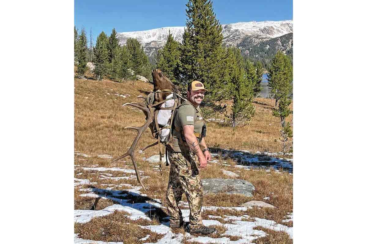 bowhunter packing out Wyoming bull elk in 2023