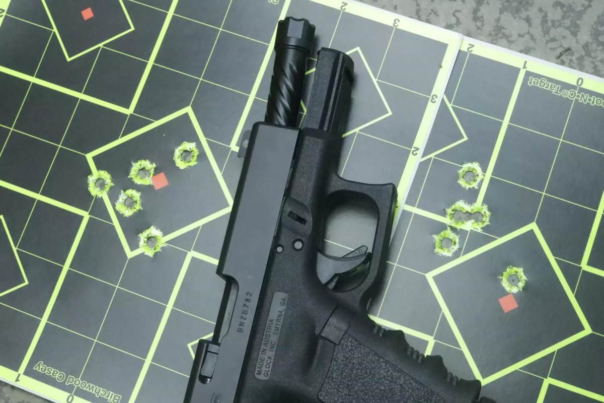Targets with shot groupings for the Glock G19 with BA replacement barrel