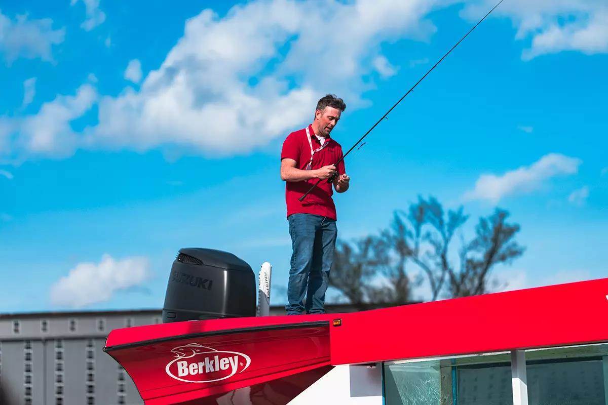 man demonstrating fishing lures