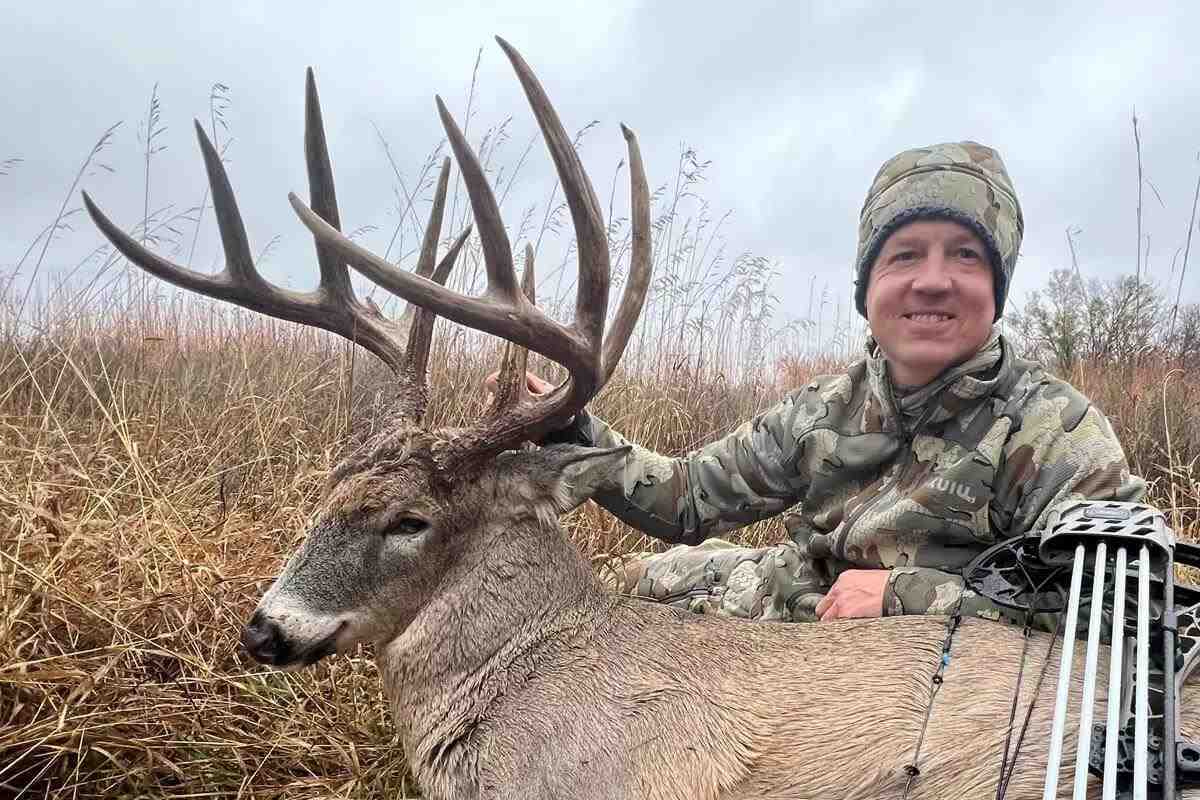 big Nebraska whitetail buck with bowhunter