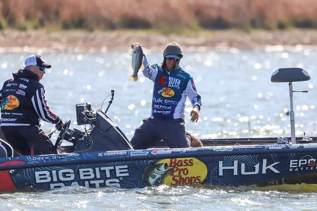 photo of angler holding up bass caught in tournament