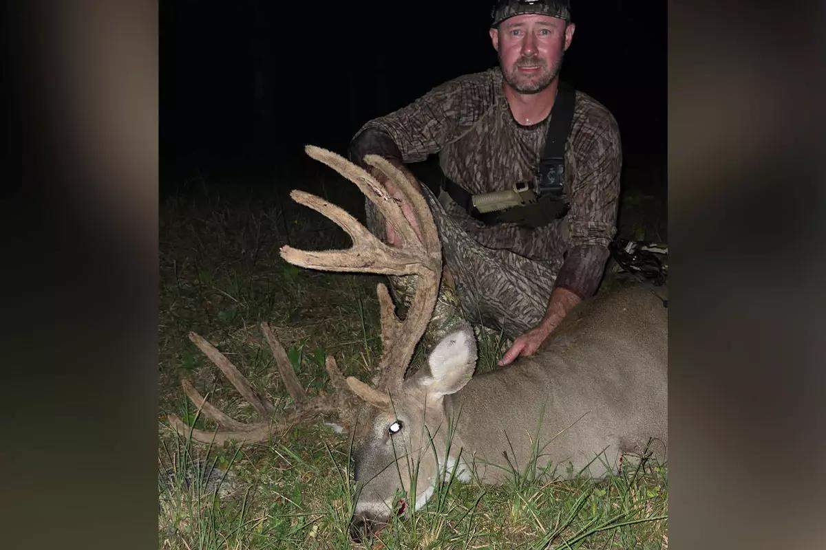 Hunter with buck