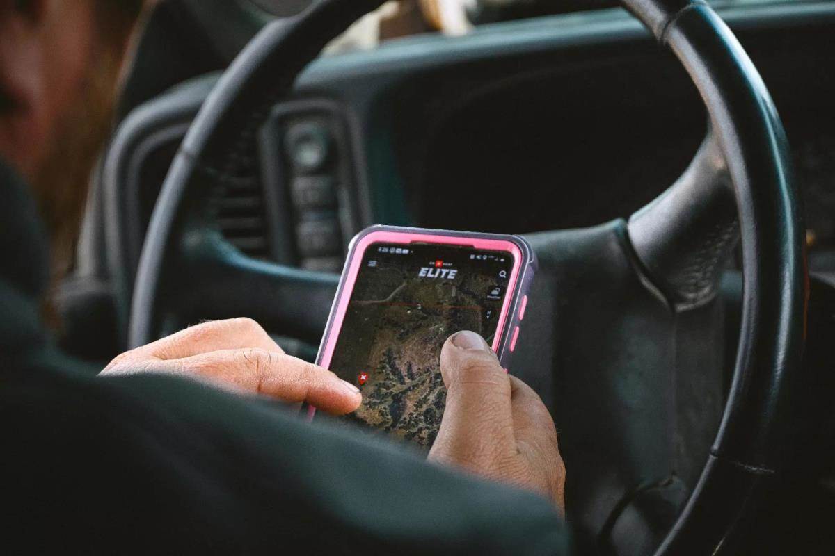 man using onX Hunt app on mobile phone