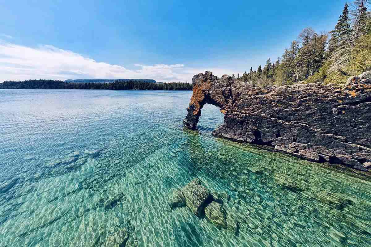 A rock formation called the Sea Lion, Sleeping Giant Provincial Park near Thunder Bay Ontario on Lake Superior. Clear blue water in the foreground, sunny day.