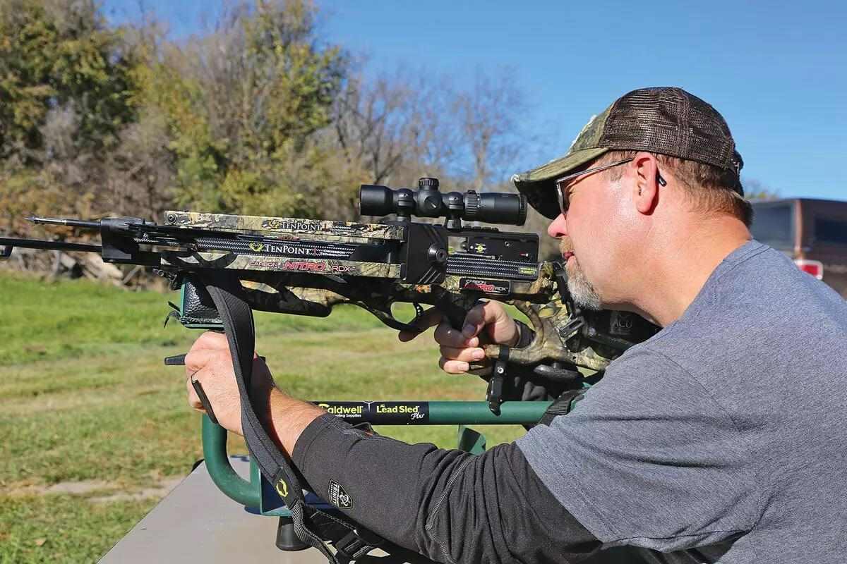 crossbow hunter practicing on shooting range