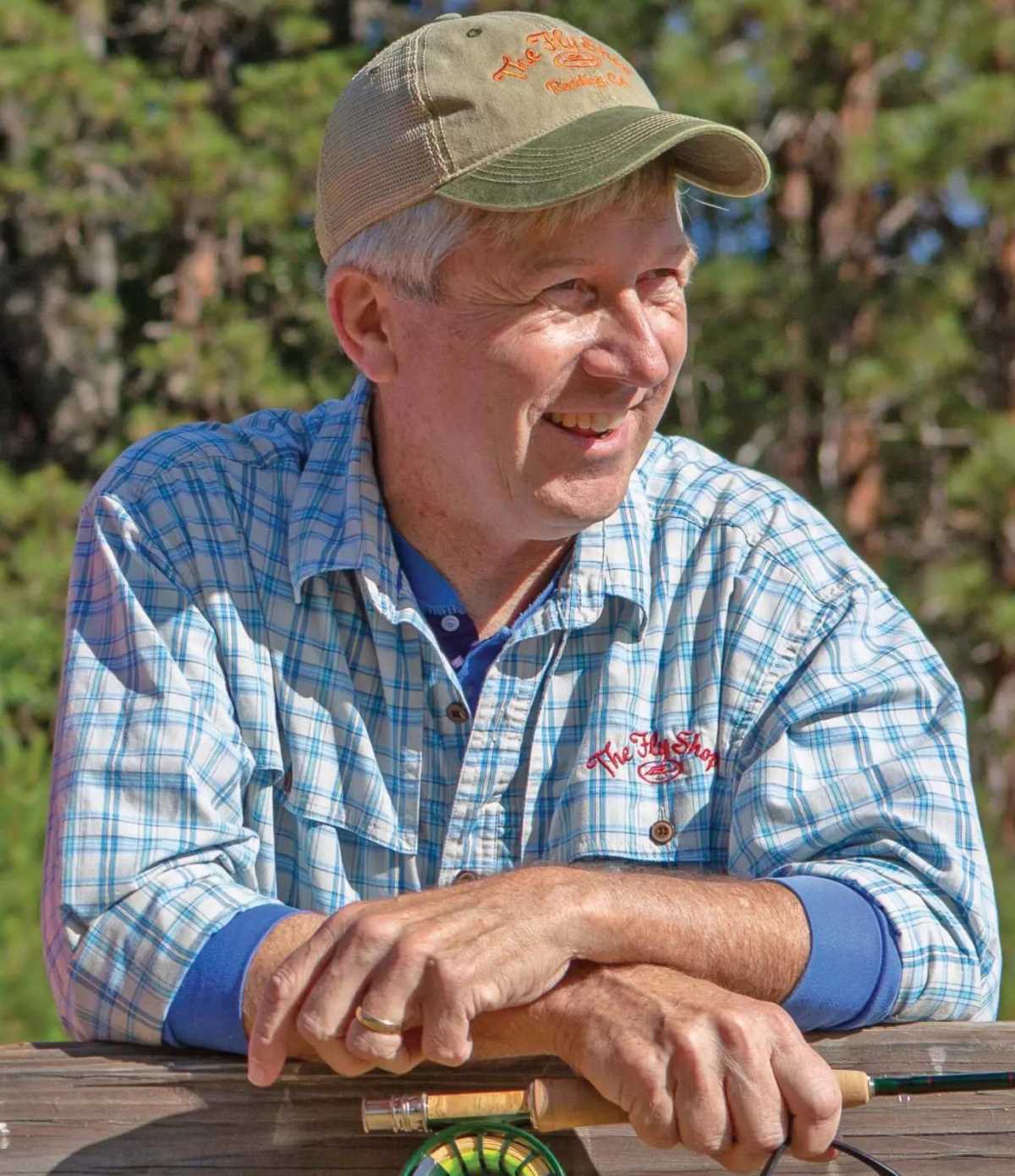 Russell Miller wearing a black hat and camo jacket.