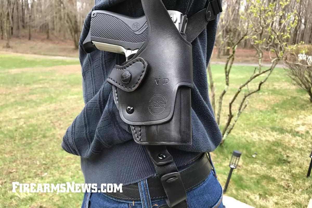 Close-up of Smith&Wesson pistol in black leather Falco shoulder holster