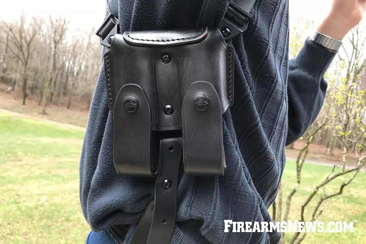 Close-up of black leather magazine pouch of worn Falco shoulder holster.