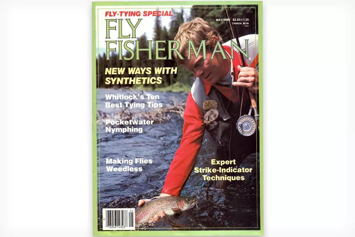 The cover of the May 1986 issue of Fly Fisherman showing a fly angler holding rainbow trout just above a river's surface.