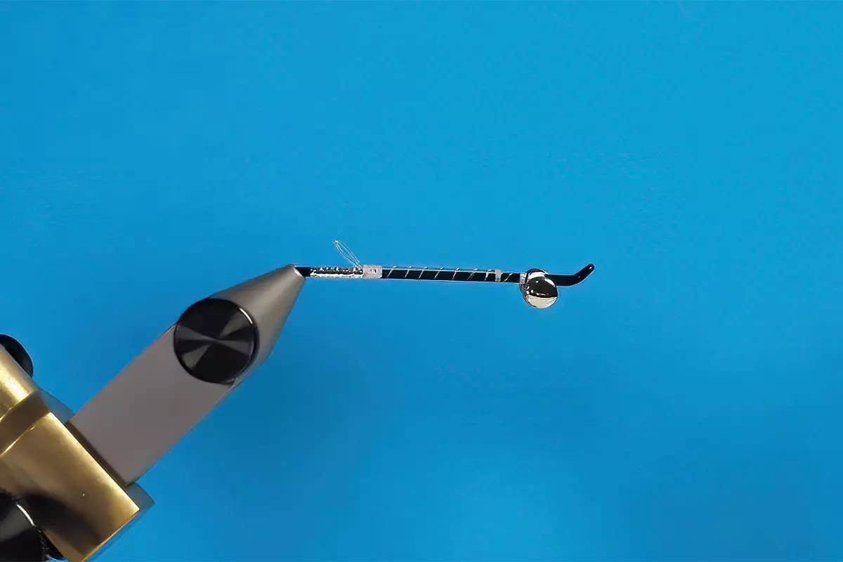 A hook in a vise; a step in a fly-tying tutorial.