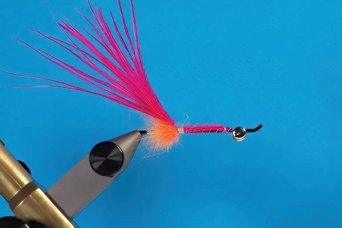 A hook in a vise; a step in a fly-tying tutorial.