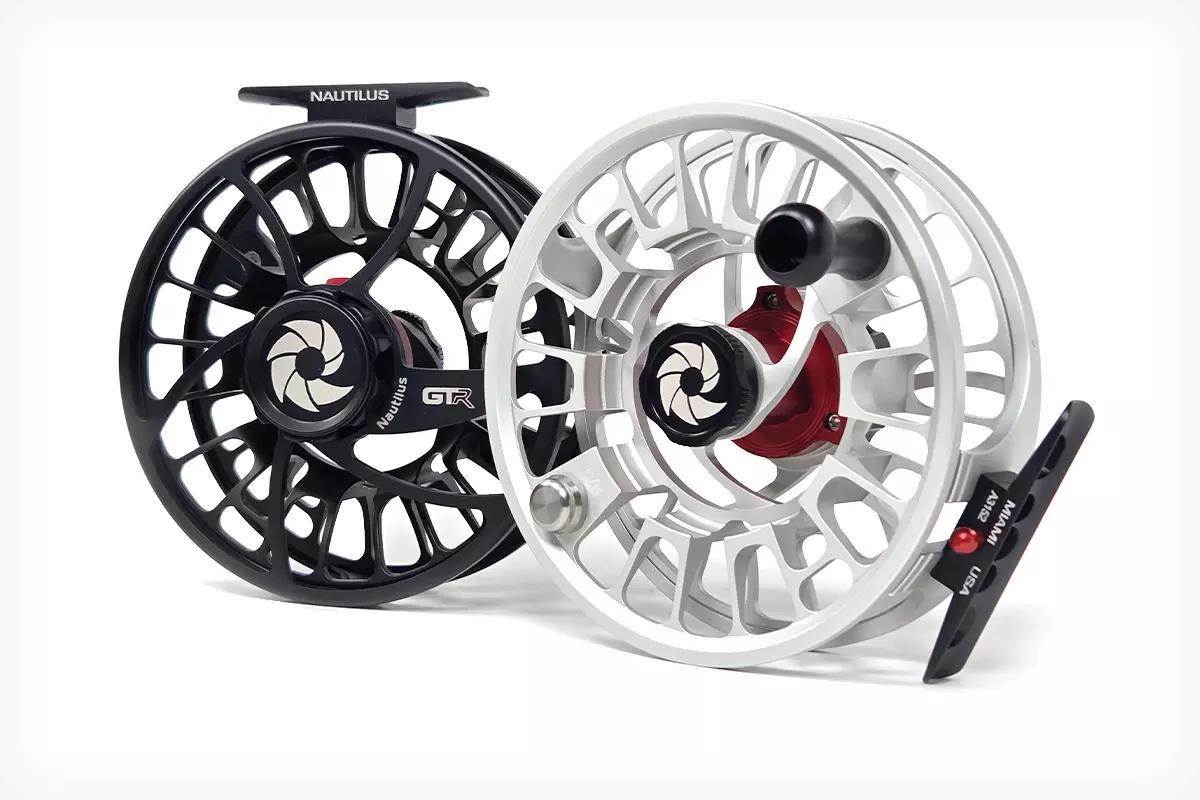 Studio photos of silver and black fly reels.