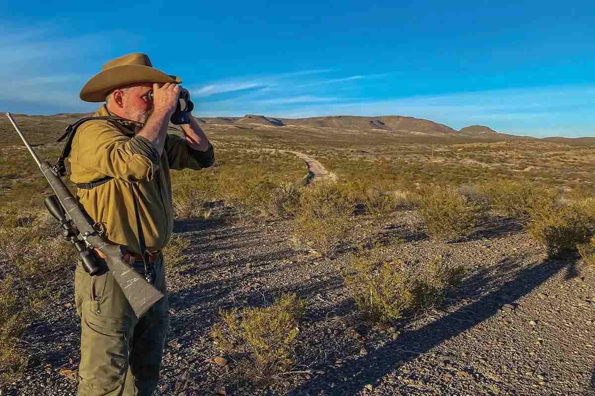 hunter looks through binocular
