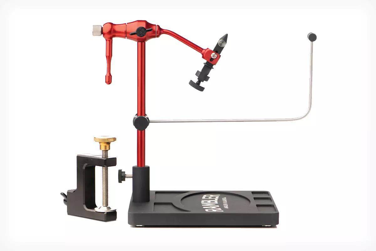 Rambler Nomad anodized aluminum travel fly-tying vise with rotary head, C-clamp, and pedestal base.