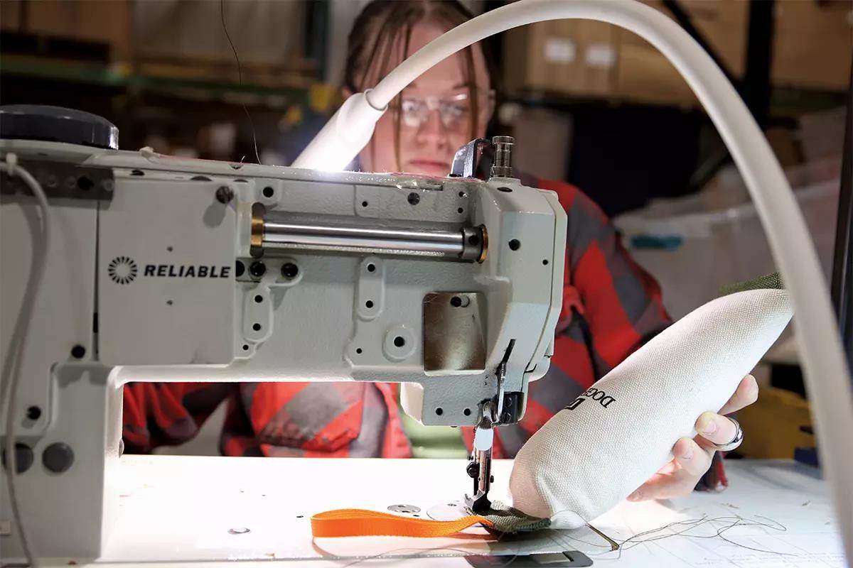 A retrieving dummy has a throwing handle sewn onto it.