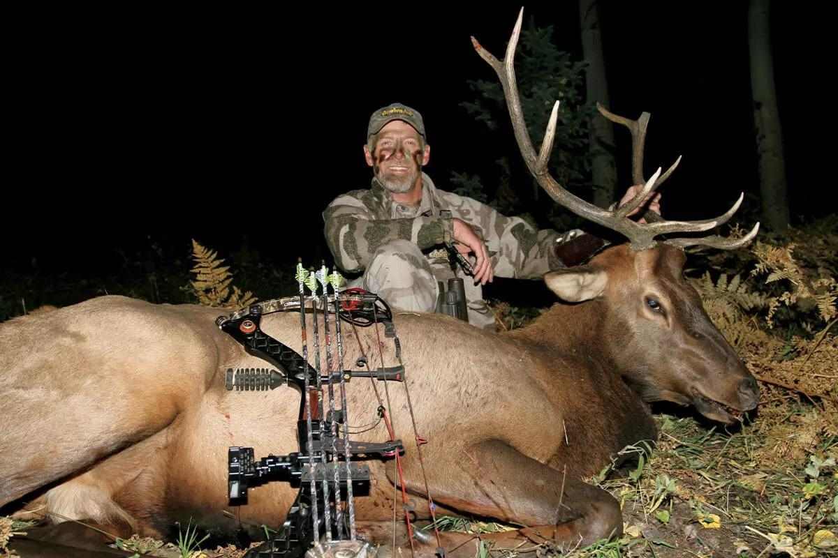 hunter with elk harvest