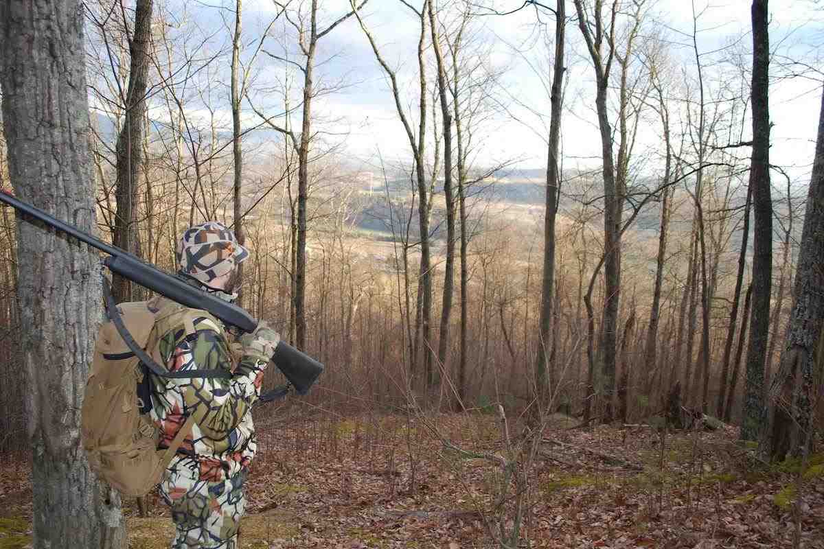 A turkey hunter checks out the view of an a nearby ag field.  