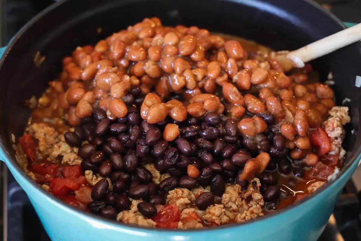 wild turkey chili ingredients being mixed in 
