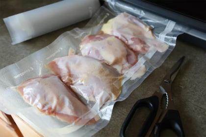 A bag with game bird breasts vacuum sealed into it.