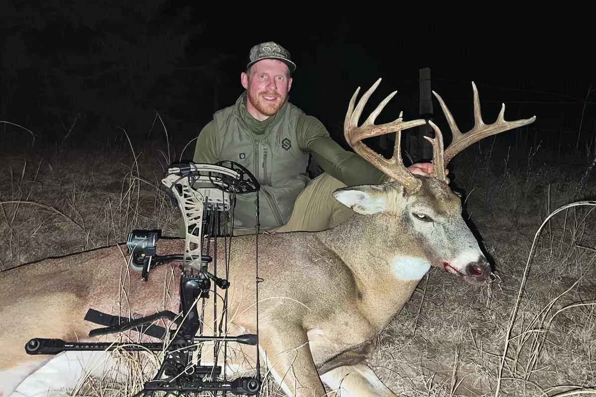 bowhunter with big Kansas whitetail buck