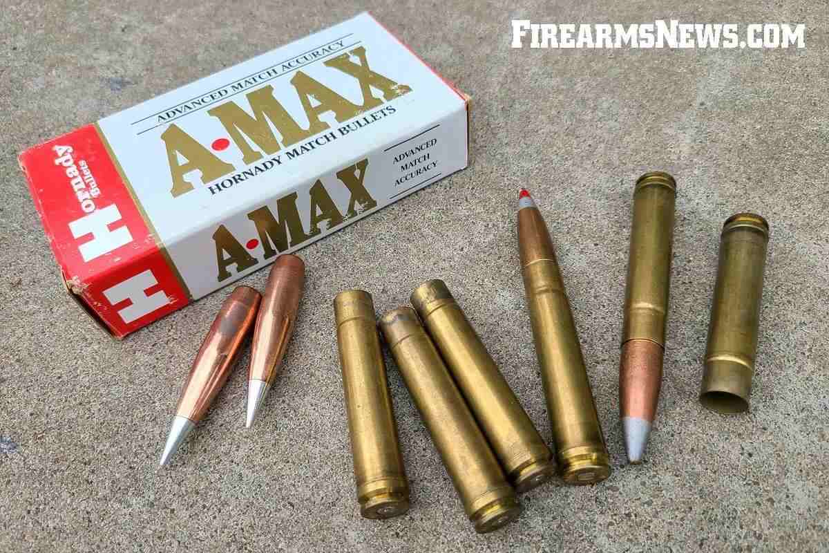 Rifle cartridges, empty cases and projectiles lying on cement with a cartridge box.