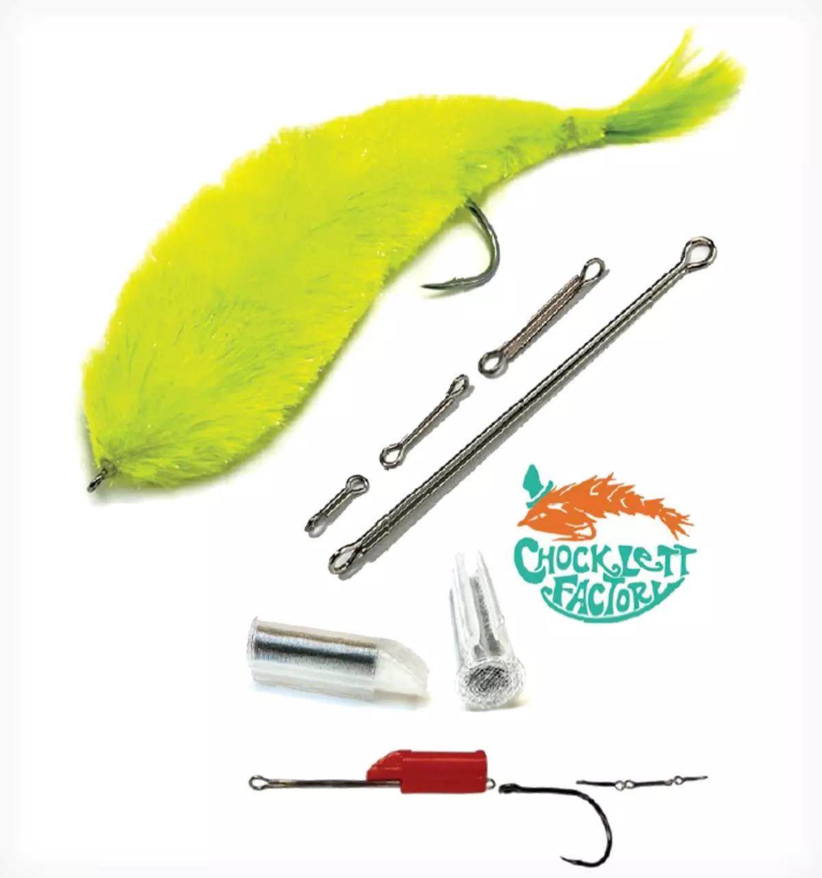 Chartreuse musky fly lure with interchangeable hook components laid out on a white background