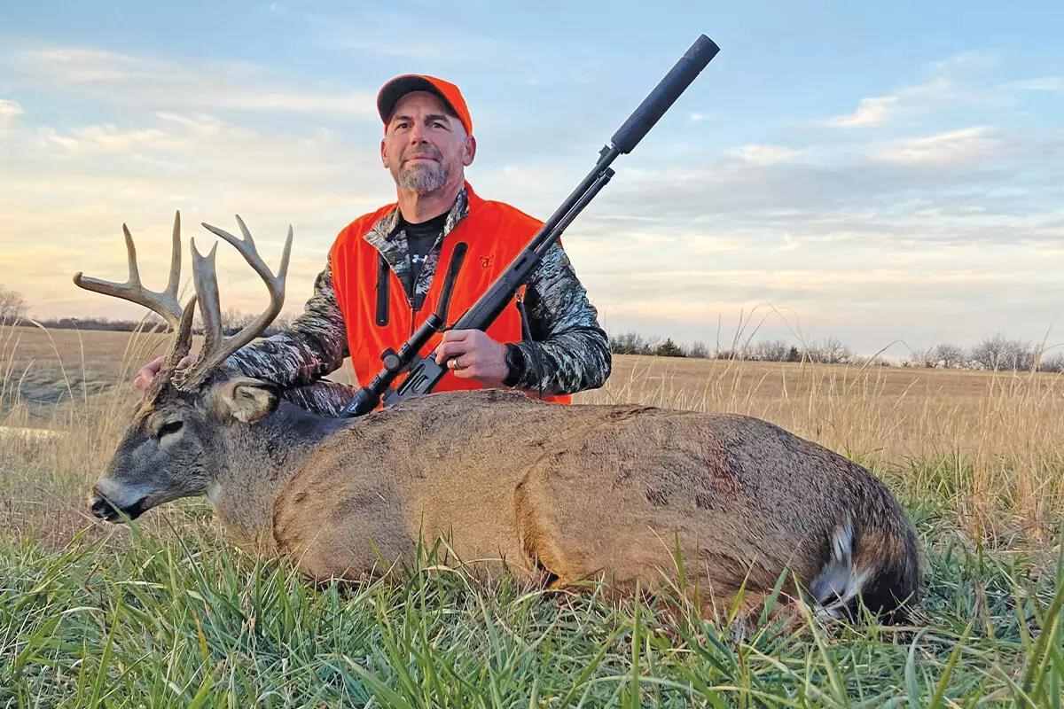 hunter with buck
